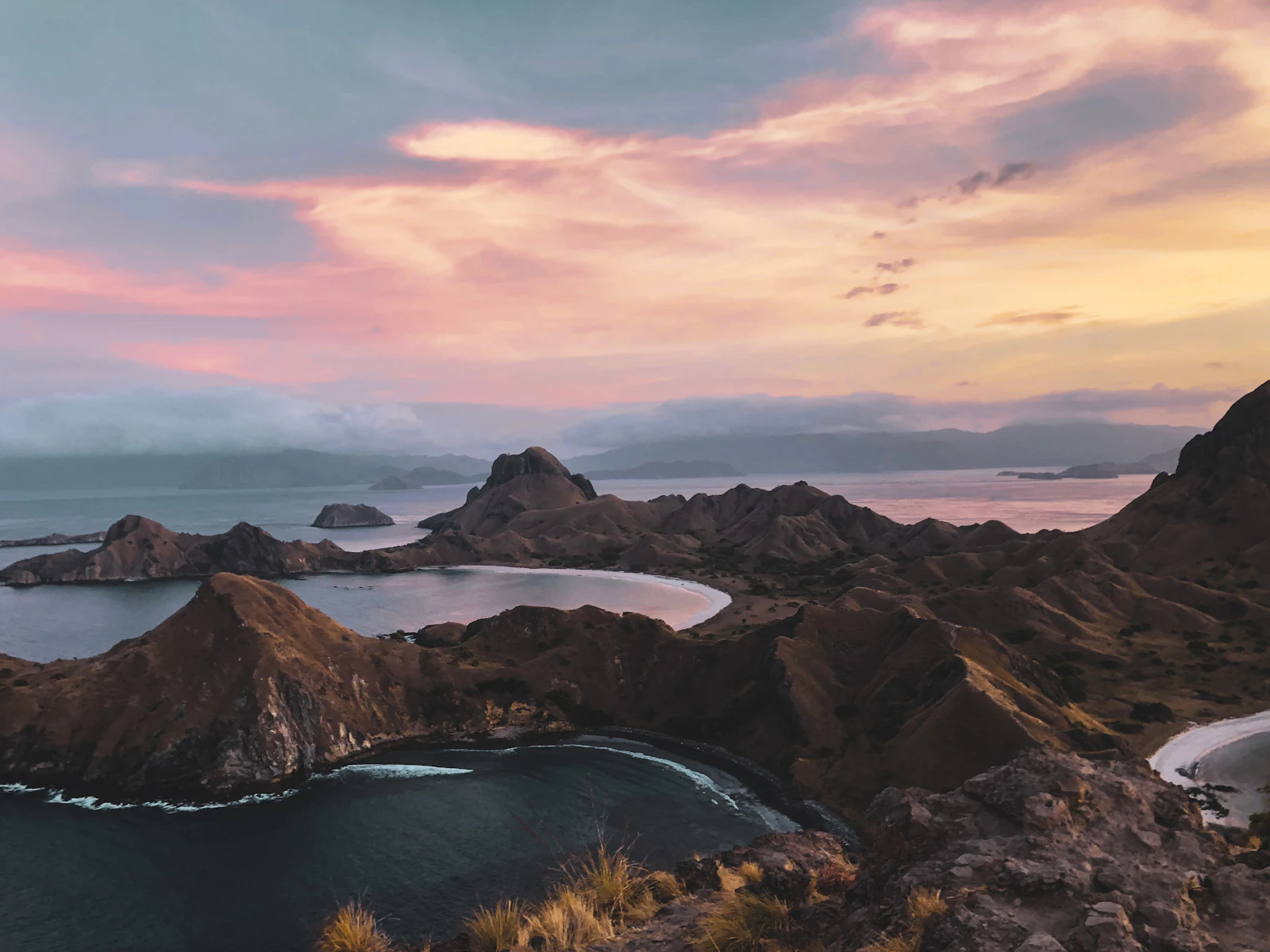 Harbor — body of water between mountains during sunset